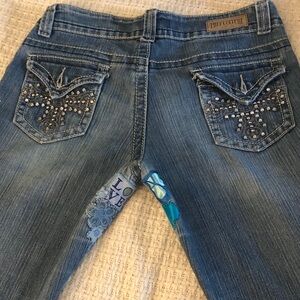 Stylish Blue Women's Skinny Jeans with blue appliqué patches
